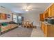 The open kitchen features oak cabinets, stainless appliances, and a cozy eating area at 204 Queensbury Ct, Acworth, GA 30102