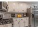 Well-equipped kitchen featuring stainless steel appliances, granite countertops, and ample cabinetry at 204 Queensbury Ct, Acworth, GA 30102