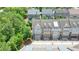 Aerial view of townhomes with private garages, peaked roofs and manicured landscaping at 2093 Callaway Nw Ct, Atlanta, GA 30318