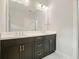Bathroom featuring double vanity with dark wood cabinetry and white counter tops at 2093 Callaway Nw Ct, Atlanta, GA 30318