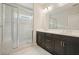Bathroom with double vanity and walk-in shower featuring marble tile at 2093 Callaway Nw Ct, Atlanta, GA 30318