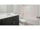 Bathroom featuring a single sink vanity, toilet and tub with shower head at 2093 Callaway Nw Ct, Atlanta, GA 30318