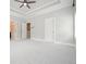 Bedroom with tray ceiling, neutral walls, carpet, and two closets at 2093 Callaway Nw Ct, Atlanta, GA 30318