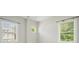 Bedroom with large double windows, white walls, and a round window allowing ample natural light at 2093 Callaway Nw Ct, Atlanta, GA 30318