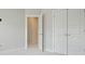 Bedroom features modern interior doors with contemporary design and carpeted floor at 2093 Callaway Nw Ct, Atlanta, GA 30318