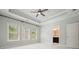 Bedroom featuring tray ceiling, natural light, and attached bathroom at 2093 Callaway Nw Ct, Atlanta, GA 30318