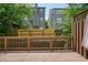 Wooden deck overlooking the neighbor's fence, perfect for relaxing outdoors with partial shade at 2093 Callaway Nw Ct, Atlanta, GA 30318