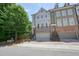 Stylish townhome featuring a two-car garage and charming brick and siding exterior at 2093 Callaway Nw Ct, Atlanta, GA 30318