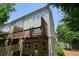 Exterior view of the home showing the siding, brick, deck, and backyard at 2093 Callaway Nw Ct, Atlanta, GA 30318