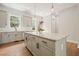 Kitchen island with granite countertops, sleek gray cabinets and stainless steel appliances at 2093 Callaway Nw Ct, Atlanta, GA 30318