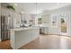 Bright kitchen with stainless appliances, gray cabinets, pendant lighting, and a large center island at 2093 Callaway Nw Ct, Atlanta, GA 30318