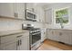 Updated kitchen features stainless steel appliances, white subway tile backsplash, and granite countertops at 2093 Callaway Nw Ct, Atlanta, GA 30318