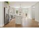Modern kitchen boasts stainless steel appliances, gray cabinetry, granite countertops, and an island with pendant lighting at 2093 Callaway Nw Ct, Atlanta, GA 30318