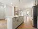Open-concept kitchen with stainless steel appliances, island with granite countertop, and hardwood floors at 2093 Callaway Nw Ct, Atlanta, GA 30318