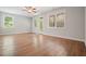 Open-concept living room with lots of natural light coming through the windows and wood flooring throughout at 2093 Callaway Nw Ct, Atlanta, GA 30318