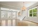 Inviting living room with hardwood floors, natural light, and seamless flow to the adjacent room at 2093 Callaway Nw Ct, Atlanta, GA 30318