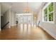 Bright living room with hardwood floors, fireplace, large windows, and open layout connecting to other areas at 2093 Callaway Nw Ct, Atlanta, GA 30318