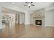 Bright living space featuring hardwood floors, a stone fireplace, and large windows for natural light at 2093 Callaway Nw Ct, Atlanta, GA 30318