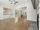 Open living area with hardwood floors, fireplace, view of kitchen, and seamless connection to other spaces at 2093 Callaway Nw Ct, Atlanta, GA 30318