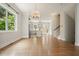 Open-concept living area with hardwood floors, kitchen view, and a staircase, blending living spaces at 2093 Callaway Nw Ct, Atlanta, GA 30318