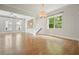 Open living room with hardwood flooring, stylish lighting, and seamless flow into other living areas at 2093 Callaway Nw Ct, Atlanta, GA 30318
