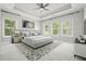 Serene main bedroom boasts tray ceilings, large windows, and stylish decor creating a peaceful retreat at 2093 Callaway Nw Ct, Atlanta, GA 30318