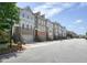 Street view showcases a row of townhomes with attractive architectural details and well-maintained landscaping at 2093 Callaway Nw Ct, Atlanta, GA 30318