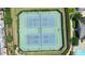 Aerial view of two tennis courts, bordered by green space, next to community at 2093 Callaway Nw Ct, Atlanta, GA 30318