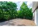 Back deck provides ample space for outdoor entertaining with wooded scenery at 219 Brick Mill Dr, Canton, GA 30115