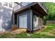 Walkout basement with a door and ramp, providing easy access to the backyard, and an upper level deck at 219 Brick Mill Dr, Canton, GA 30115