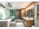 Stunning primary bath features a luxurious freestanding tub, glass-enclosed shower and dual sink vanity at 219 Brick Mill Dr, Canton, GA 30115