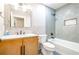 Bright bathroom features a modern vanity, stylish fixtures, and decorative tile work in the shower/tub area at 219 Brick Mill Dr, Canton, GA 30115