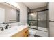 Updated bathroom features tiled shower with glass door, modern vanity, and stylish mirror at 219 Brick Mill Dr, Canton, GA 30115