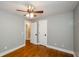 Bedroom features hardwood floors, neutral walls, and a closet at 219 Brick Mill Dr, Canton, GA 30115