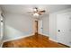 Neutral bedroom showcases hardwood floors, ample natural light, and white trim at 219 Brick Mill Dr, Canton, GA 30115