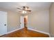 Bedroom features hardwood floors, a ceiling fan, and a window with natural light at 219 Brick Mill Dr, Canton, GA 30115