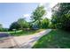 Scenic view of the long driveway leading up to a home nestled among lush trees at 219 Brick Mill Dr, Canton, GA 30115