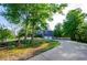 View of the home and long, curved driveway leading up to an attached two-car garage at 219 Brick Mill Dr, Canton, GA 30115