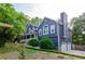 Charming two-story home featuring blue siding, white trim, and an attached two-car garage at 219 Brick Mill Dr, Canton, GA 30115