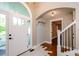 Bright foyer featuring tile flooring and an archway leading to the living areas at 219 Brick Mill Dr, Canton, GA 30115