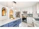 Bright kitchen features a center island, stainless steel appliances, and stylish lighting fixtures at 219 Brick Mill Dr, Canton, GA 30115