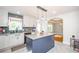 Bright kitchen features a center island, granite countertops, and stylish lighting fixtures at 219 Brick Mill Dr, Canton, GA 30115