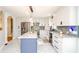 Bright kitchen features a center island, stainless steel appliances, and stylish lighting fixtures at 219 Brick Mill Dr, Canton, GA 30115
