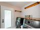 Functional laundry room boasts front-load washer/dryer and plenty of storage space at 219 Brick Mill Dr, Canton, GA 30115