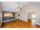 Open living space with hardwood flooring, archways, and views into adjacent rooms at 219 Brick Mill Dr, Canton, GA 30115