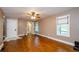 Bright living room with hardwood floors, large windows, and white trim throughout at 219 Brick Mill Dr, Canton, GA 30115