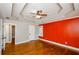 Spacious primary bedroom boasts hardwood floors, tray ceiling, decorative wall and natural light from a window at 219 Brick Mill Dr, Canton, GA 30115