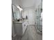 Bathroom features double sink vanity with granite countertop and a modern glass shower with pebble floor at 28 Samuel Nw Way, Cartersville, GA 30121