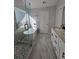 Bathroom with modern shower, freestanding tub, double vanity with granite countertop, and gray tiled flooring at 28 Samuel Nw Way, Cartersville, GA 30121
