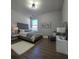 Neutral bedroom with upholstered headboard, wood floors, and plenty of natural light at 28 Samuel Nw Way, Cartersville, GA 30121